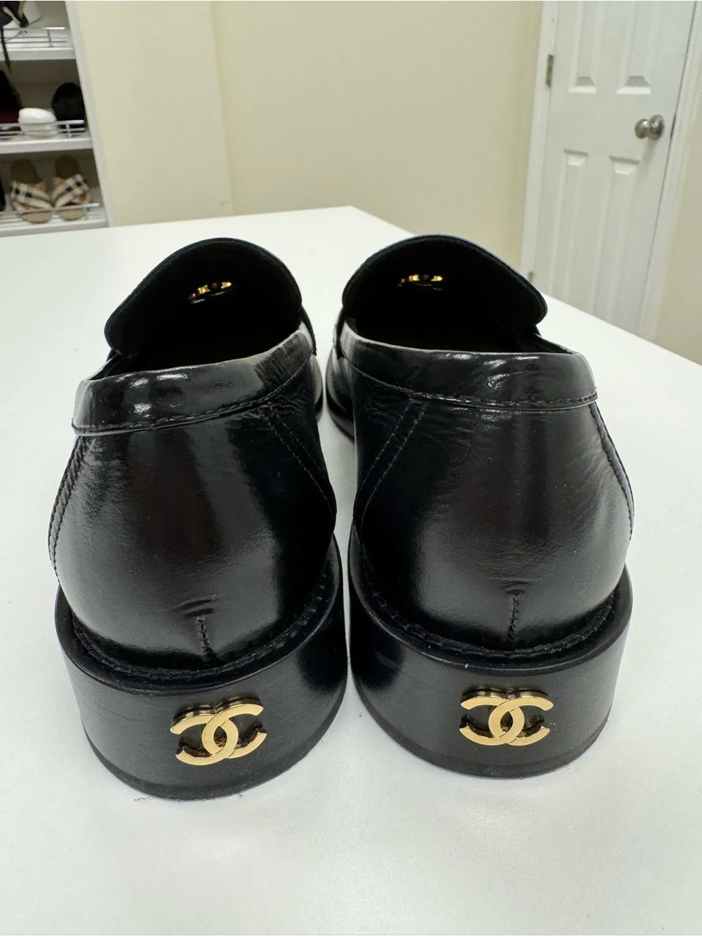 CHANEL Black Leather Loafers with Gold CC Medallions